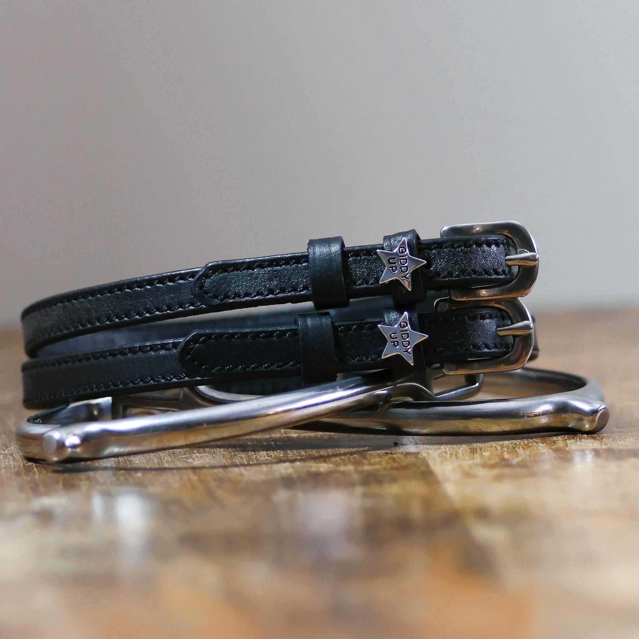 ManeJane Giddy Up Spur Straps Spur Straps — black leather, non-stretch, hero image for English riders.