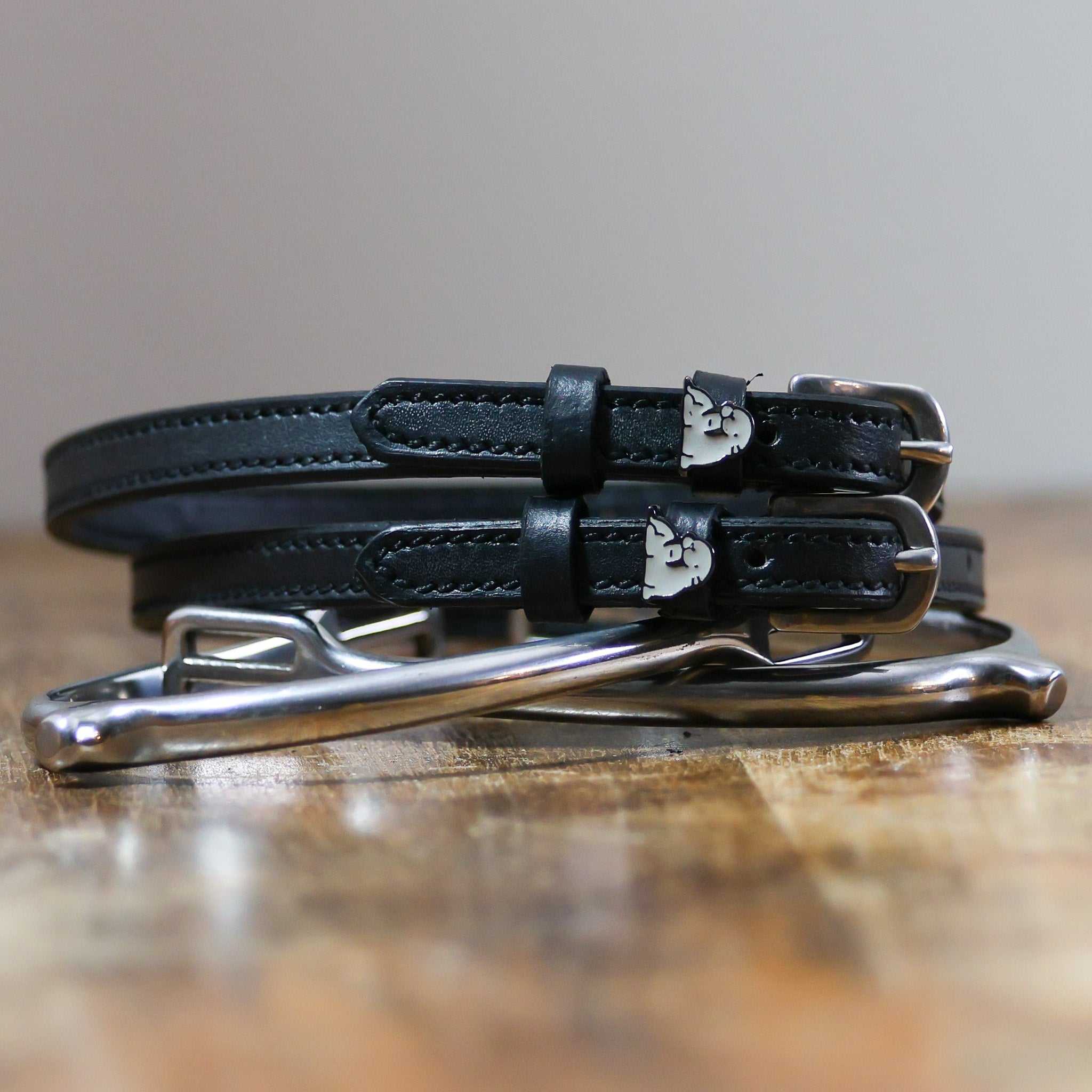 ManeJane Walrus Spur Straps Spur Straps — black leather, non-stretch, hero image for English riders.