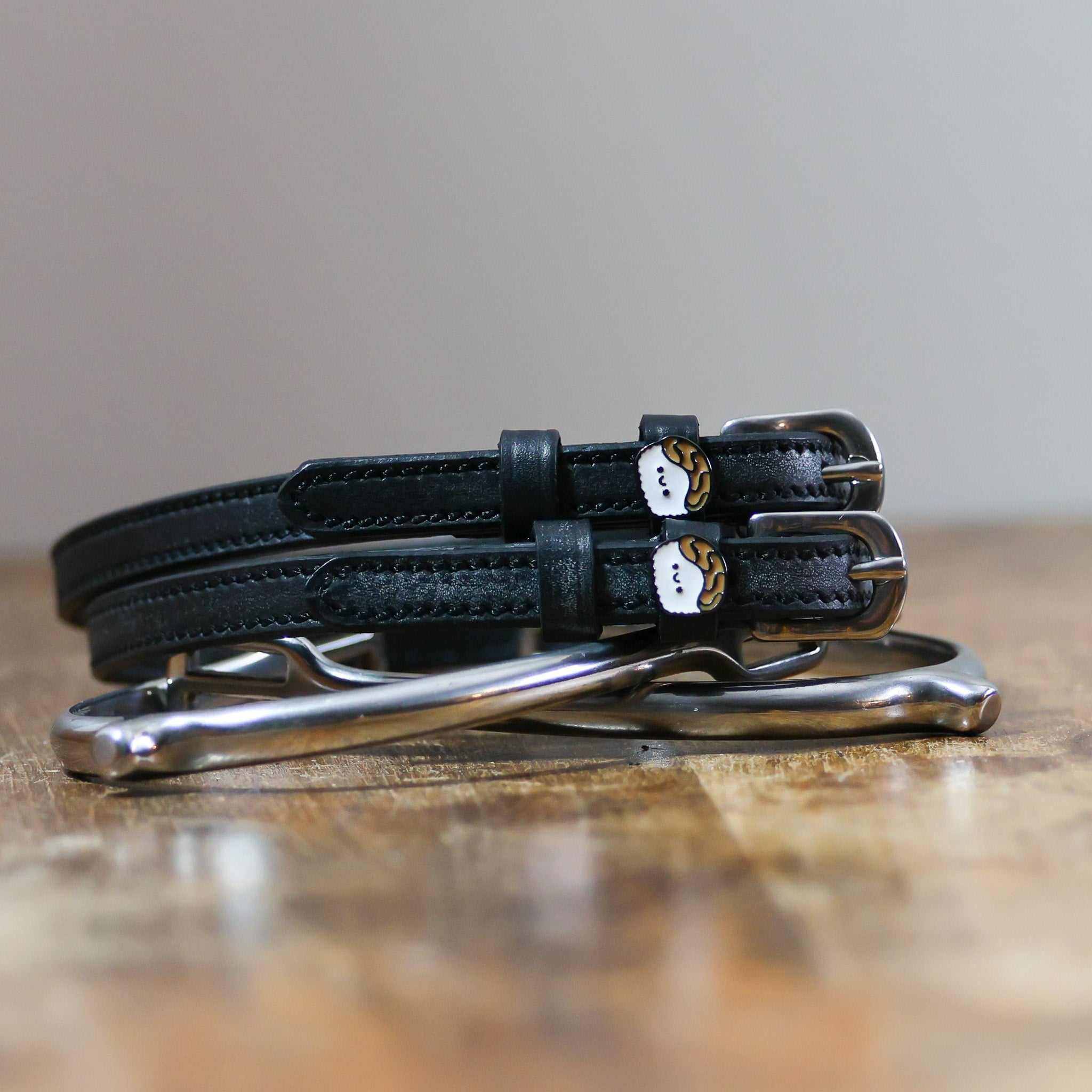 ManeJane Sushi Spur Straps Spur Straps — black leather, non-stretch, hero image for English riders.