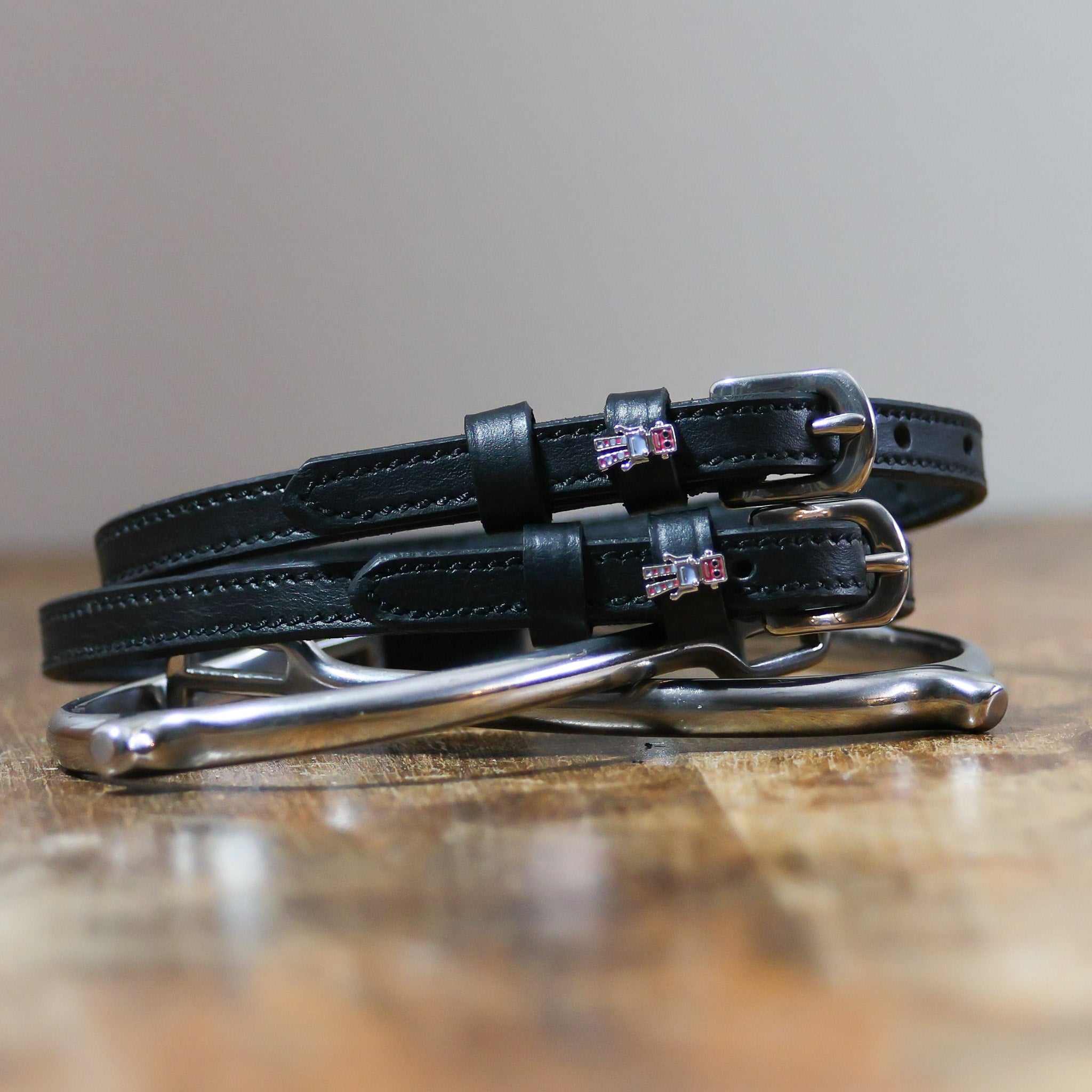 ManeJane Robot Spur Straps Spur Straps — black leather, non-stretch, hero image for English riders.