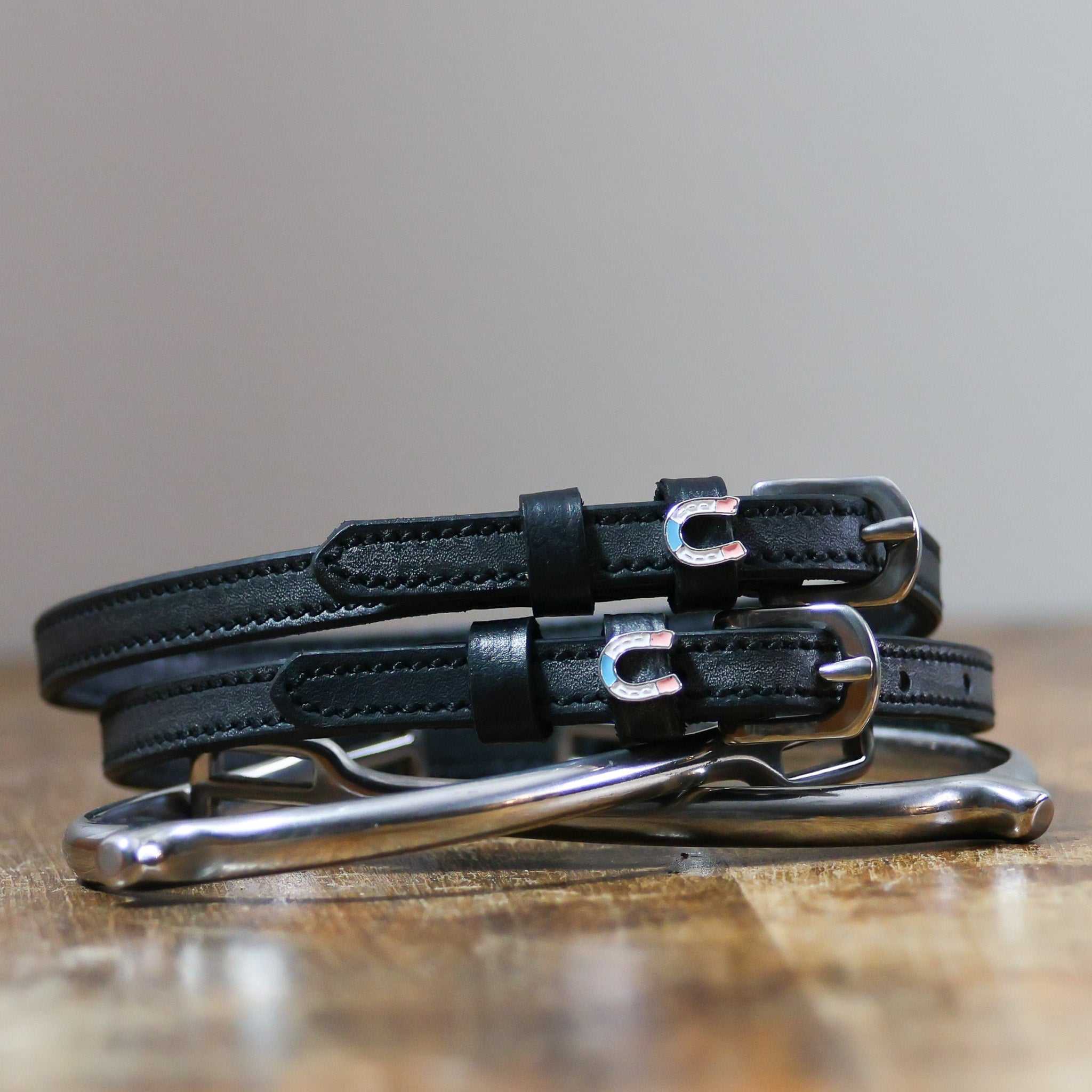 ManeJane Horse Shoe Party Spur Straps Spur Straps — black leather, non-stretch, hero image for English riders.