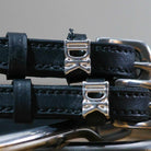 Black leather spur straps with stainless steel buckles and custom "I Don't Know" silver charms