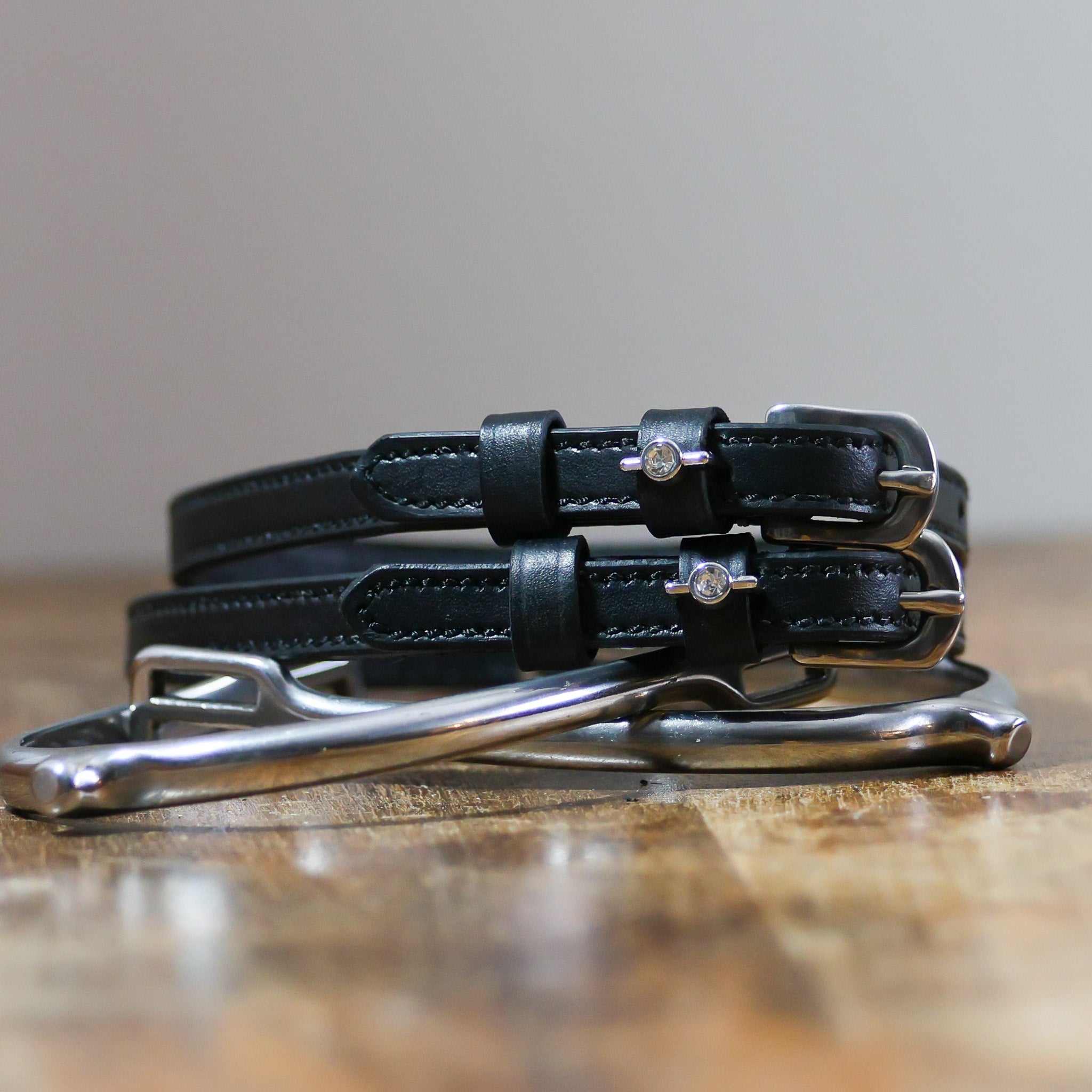 ManeJane Single Clear Stone Spur Straps Spur Straps — black leather, non-stretch, hero image for English riders.