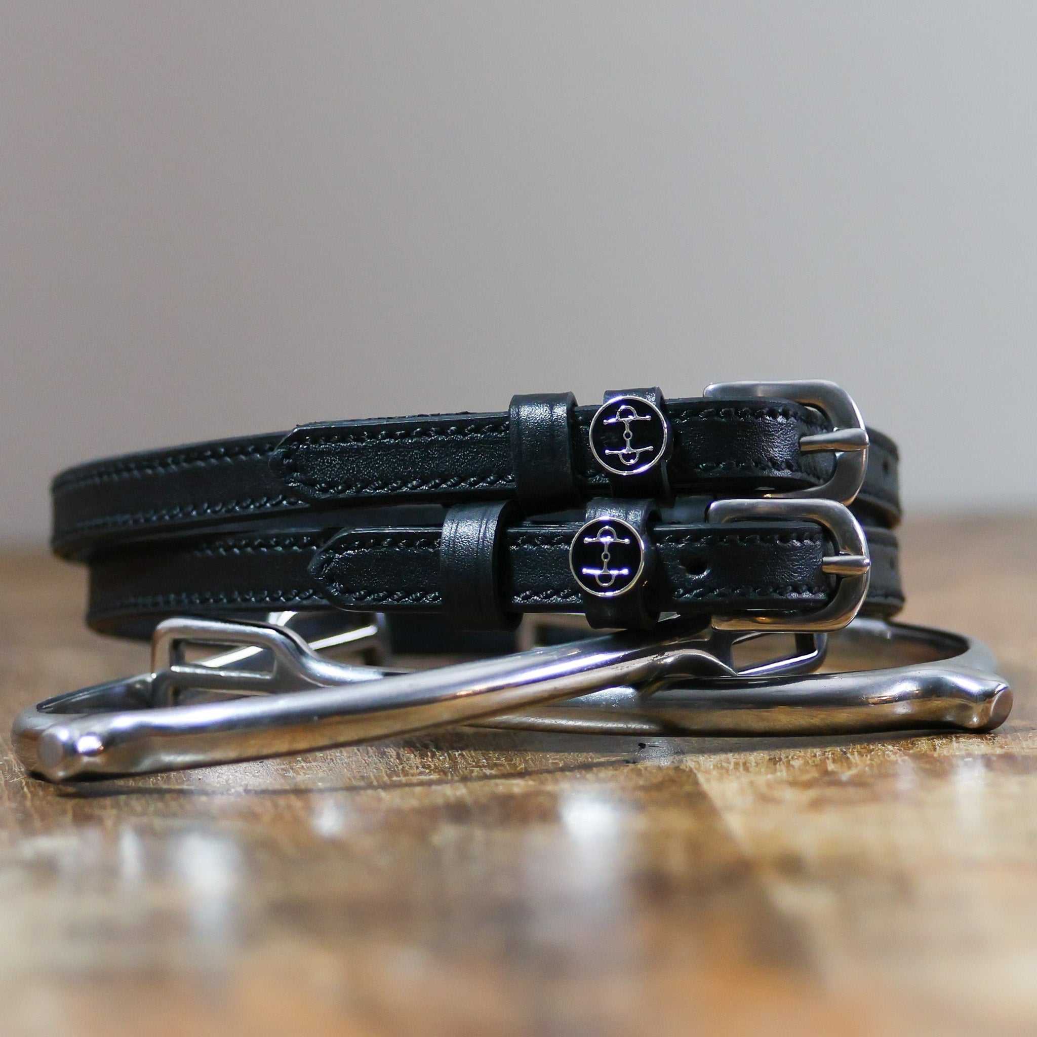 ManeJane Full Cheek Spur Straps Spur Straps — black leather, non-stretch, hero image for English riders.