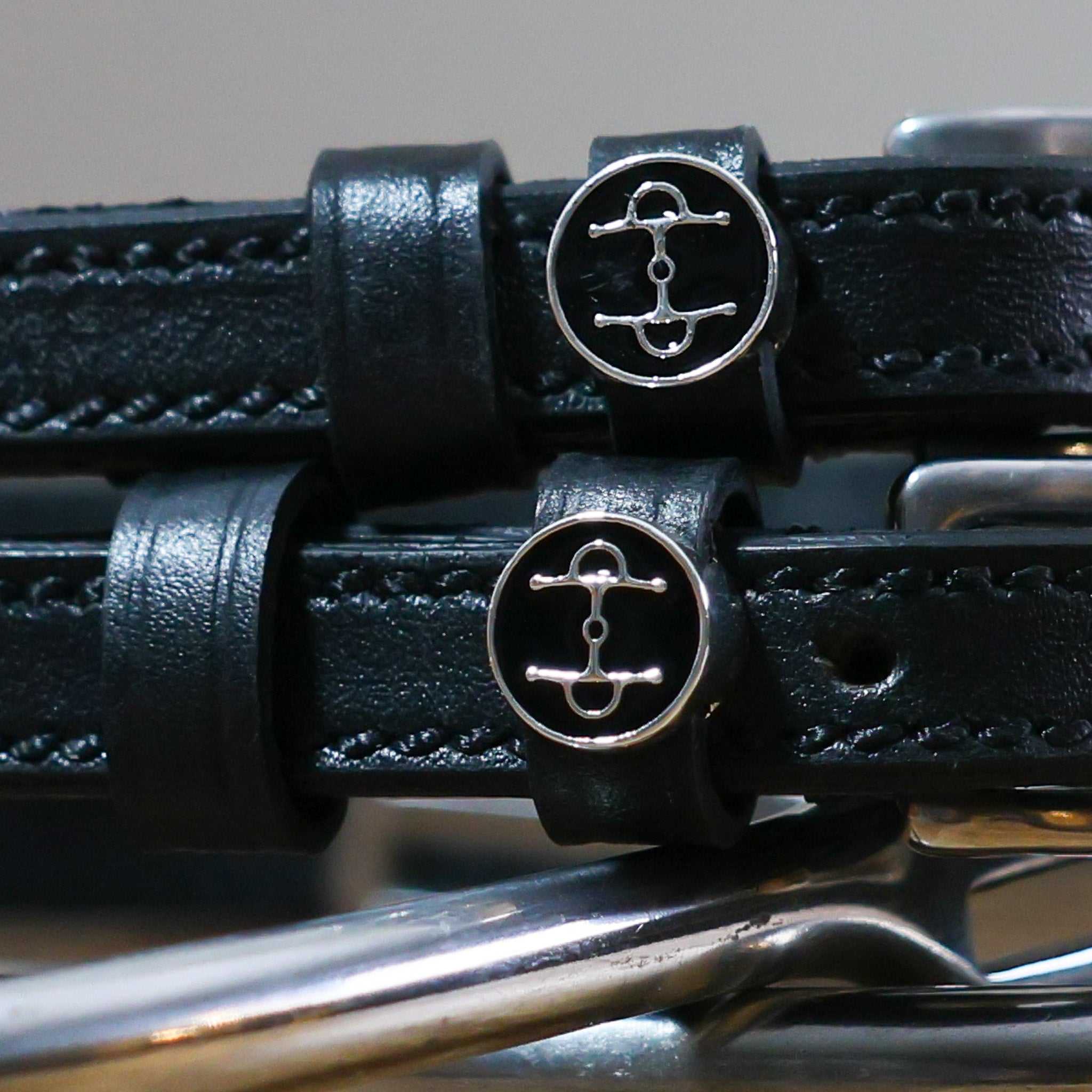 Black leather Full Cheek Spur Straps with stainless steel buckle and custom ManeJane charm