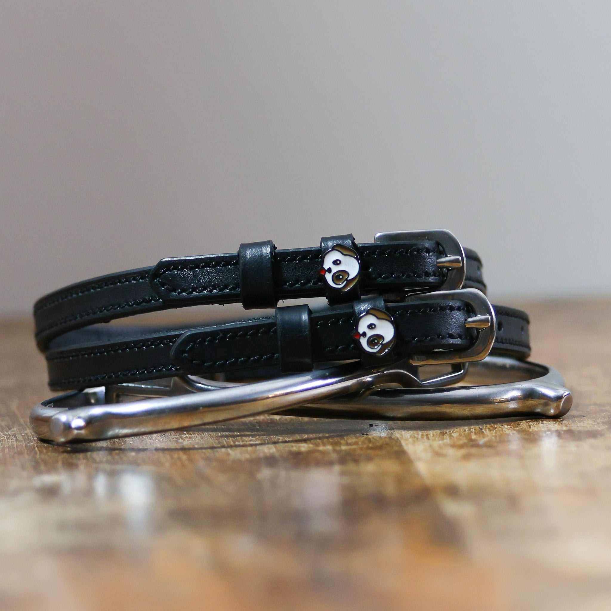ManeJane Dog - Puppy Spur Straps Spur Straps — black leather, non-stretch, hero image for English riders.
