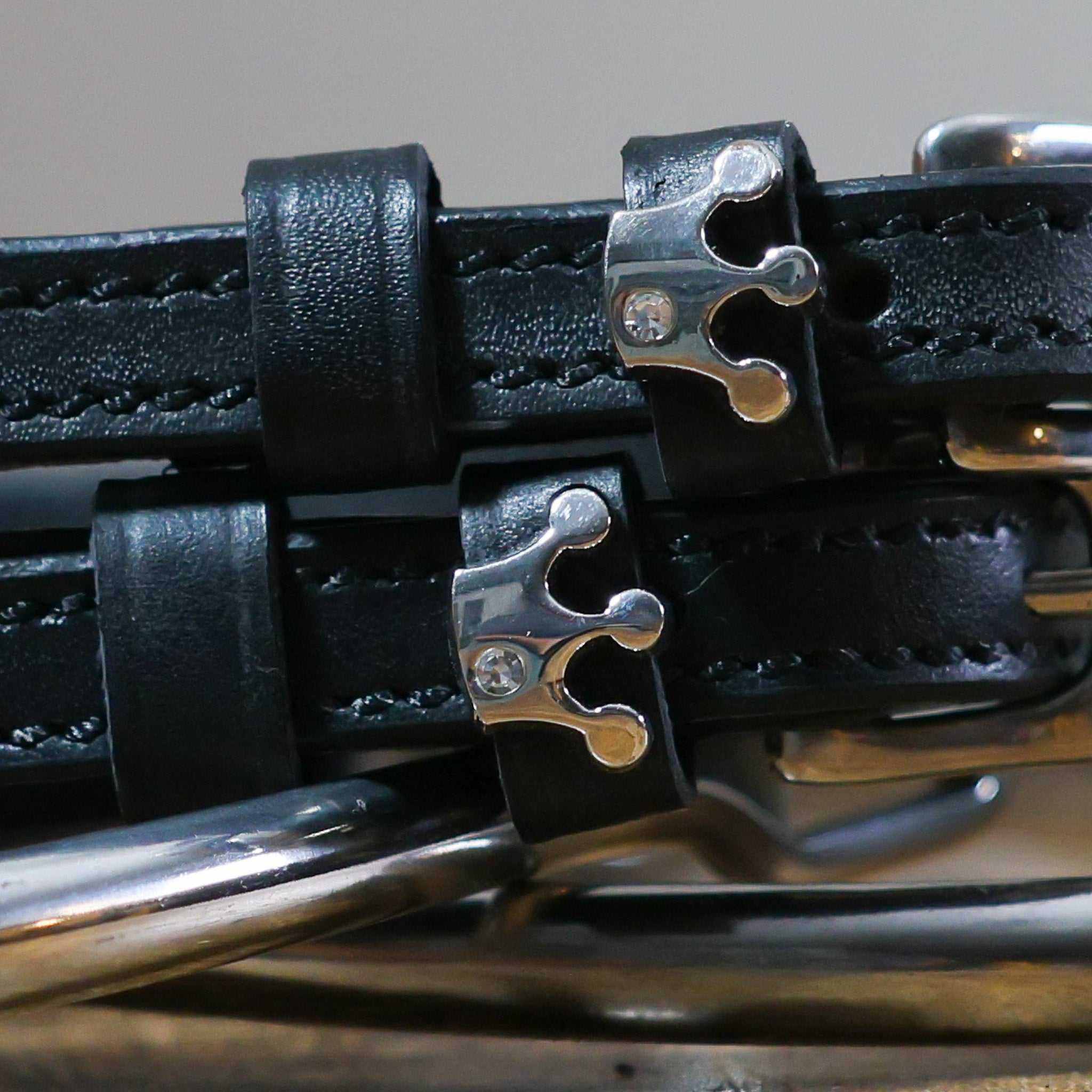 Black leather Queenie Spur Straps with stainless steel crown buckle and custom charm