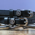 Black leather Capricorn Spur Straps with stainless steel buckles and custom Capricorn charms