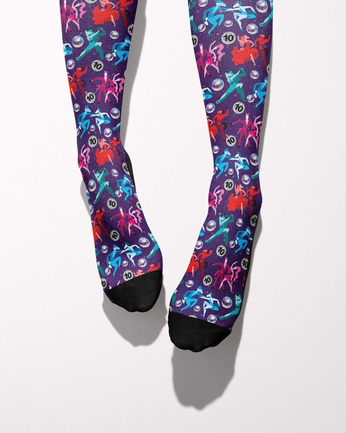 Prancing with the Stars Limited Edition boot socks, dancing couples and disco balls on deep purple, worn, showing the full-length pattern, by Dreamers & Schemers