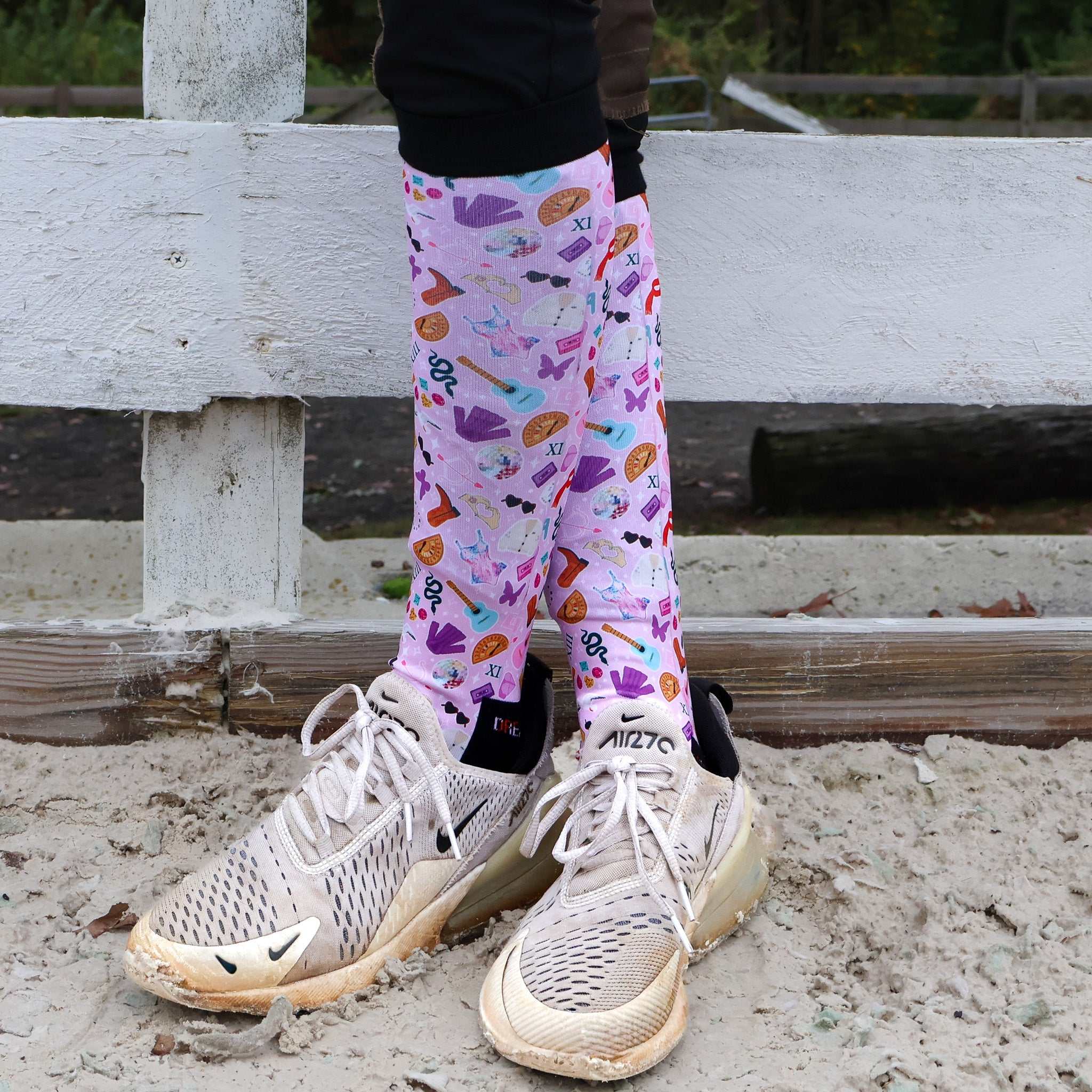 Limited edition colorful boot socks with unique prints worn with sneakers outdoors