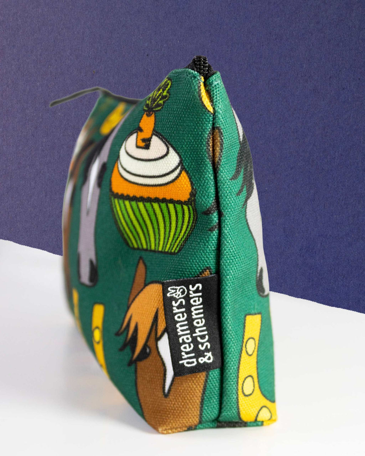 Carrot Cake pouch standing on its gusset, the carrot cupcake print running across the side panel