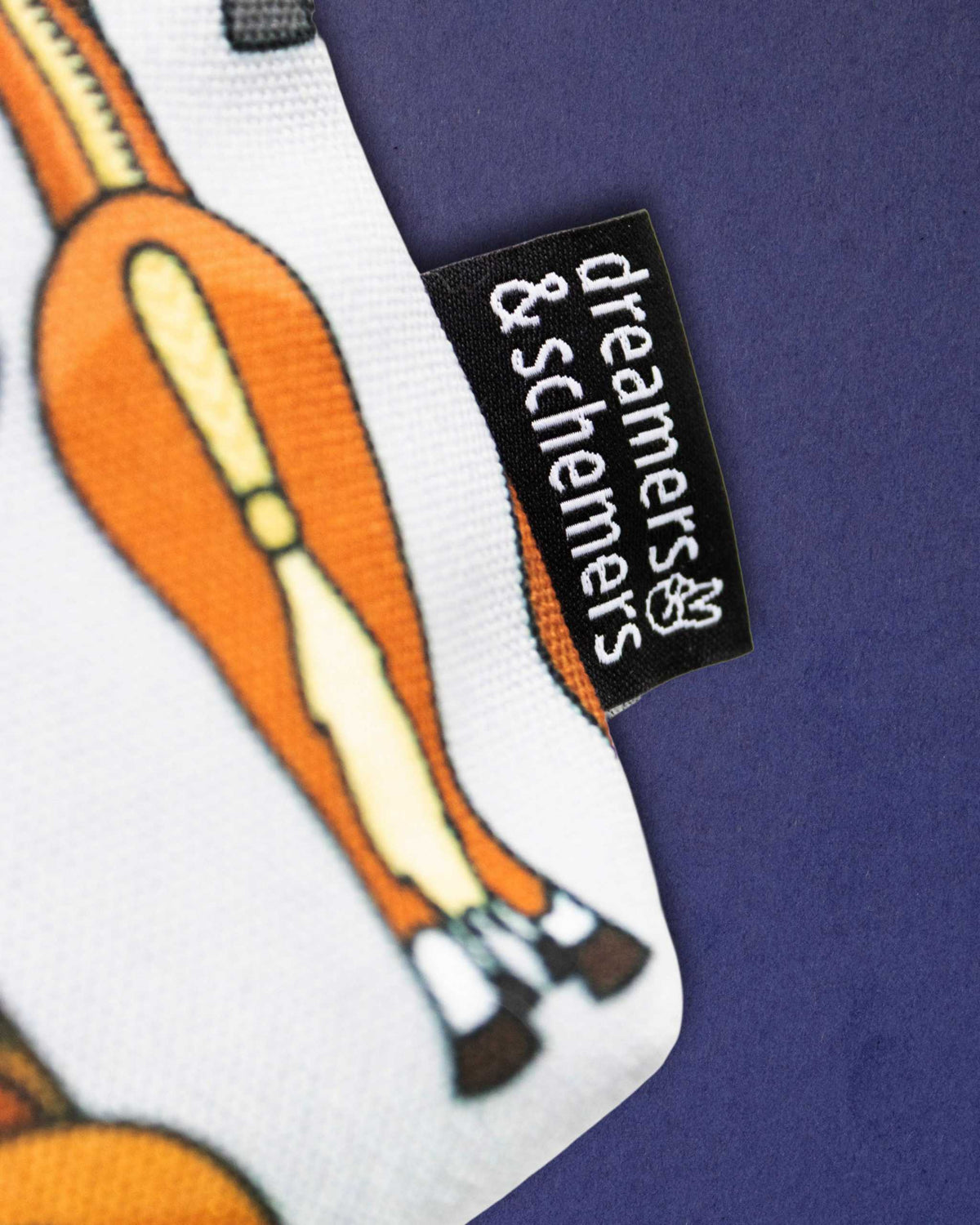 Close-up of a chestnut pony's hindquarters on the Butts pouch, beside the woven brand tag