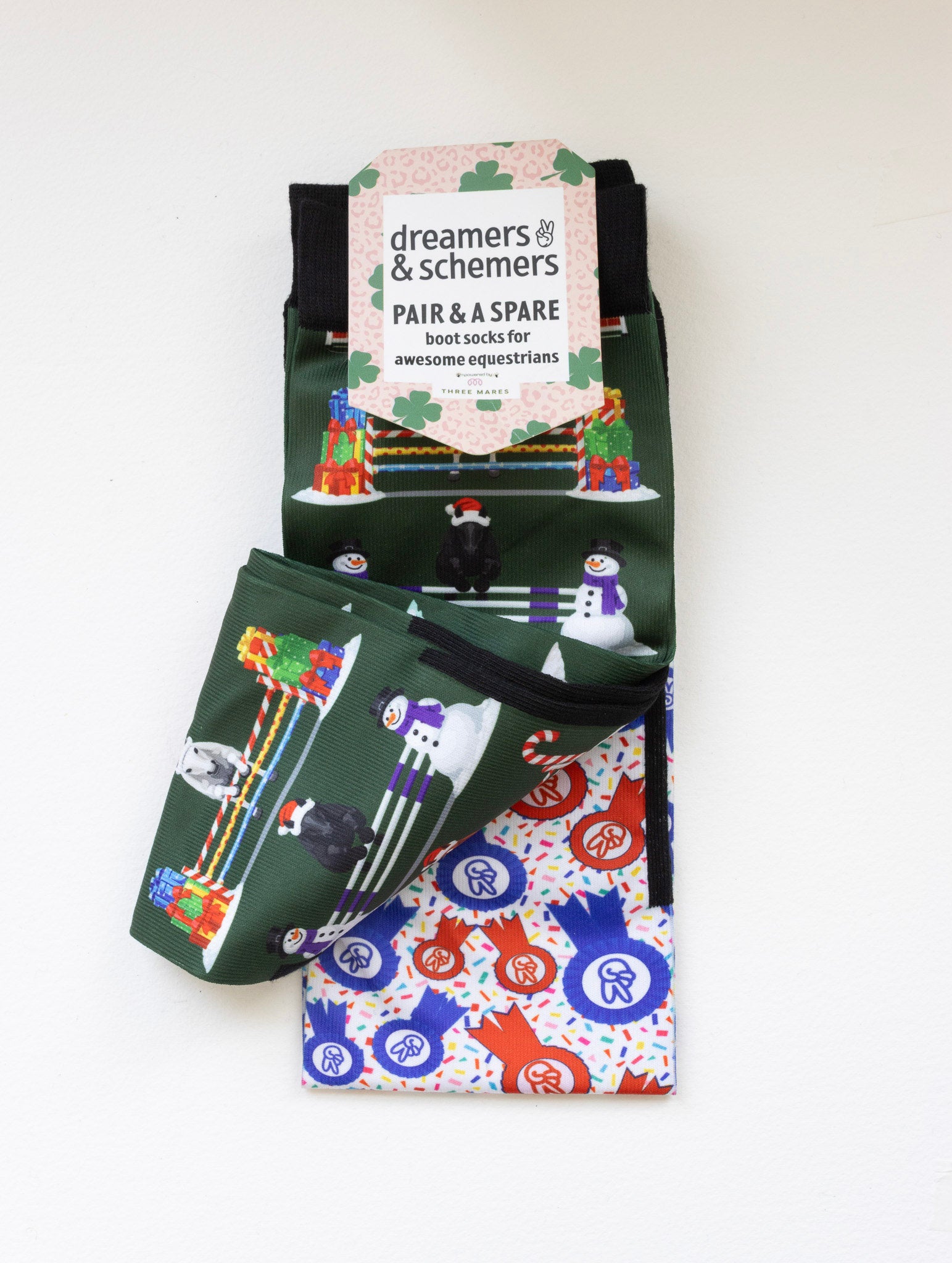 Jump for Joy youth boot socks shown folded with the included spare sock and patterned cuff
