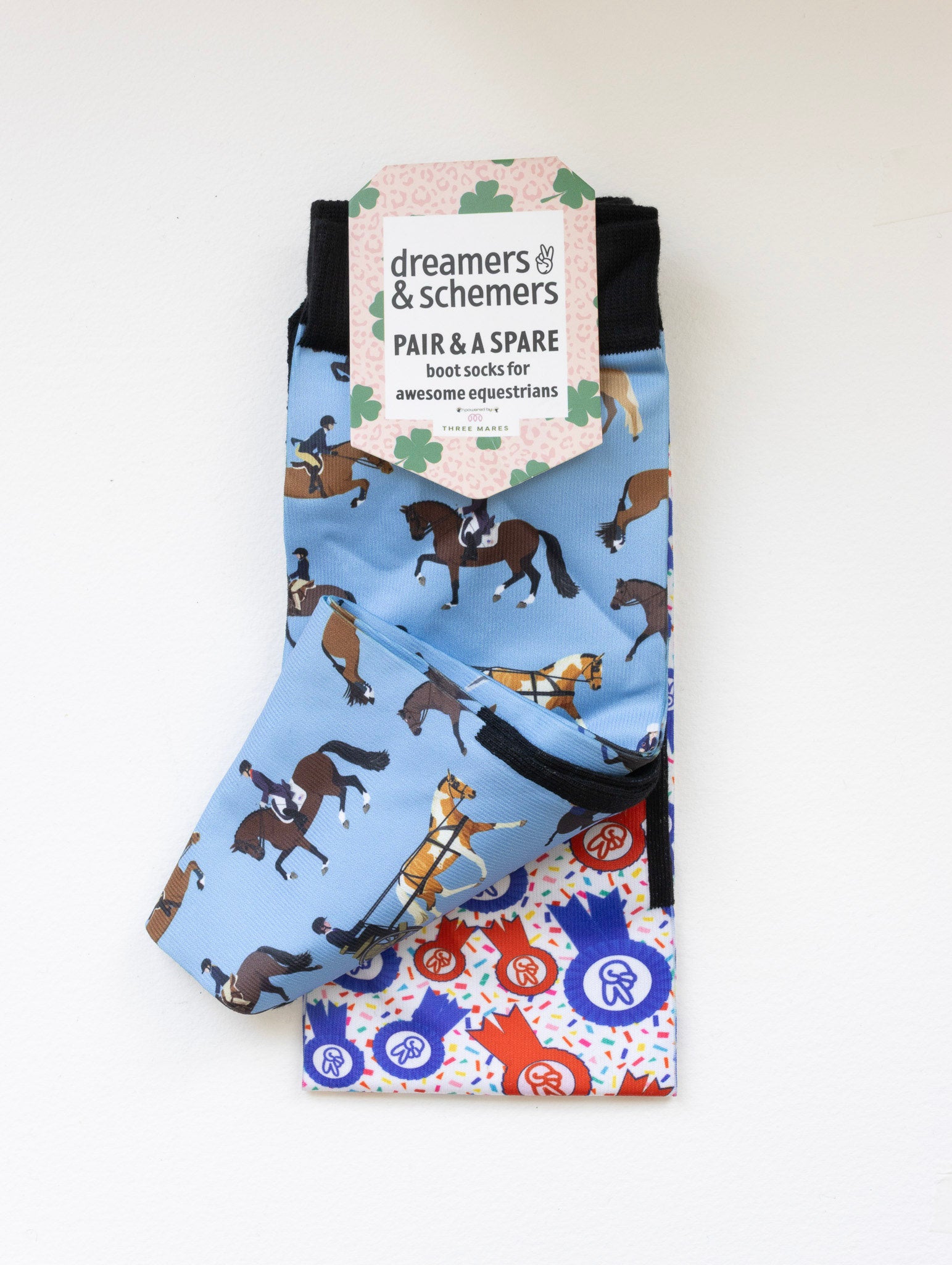 The Pony Island Horse Sports boot socks shown folded with the included spare sock and printed cuff detail