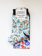 Otter-ly Adorable boot socks shown folded with the included spare sock and printed cuff detail
