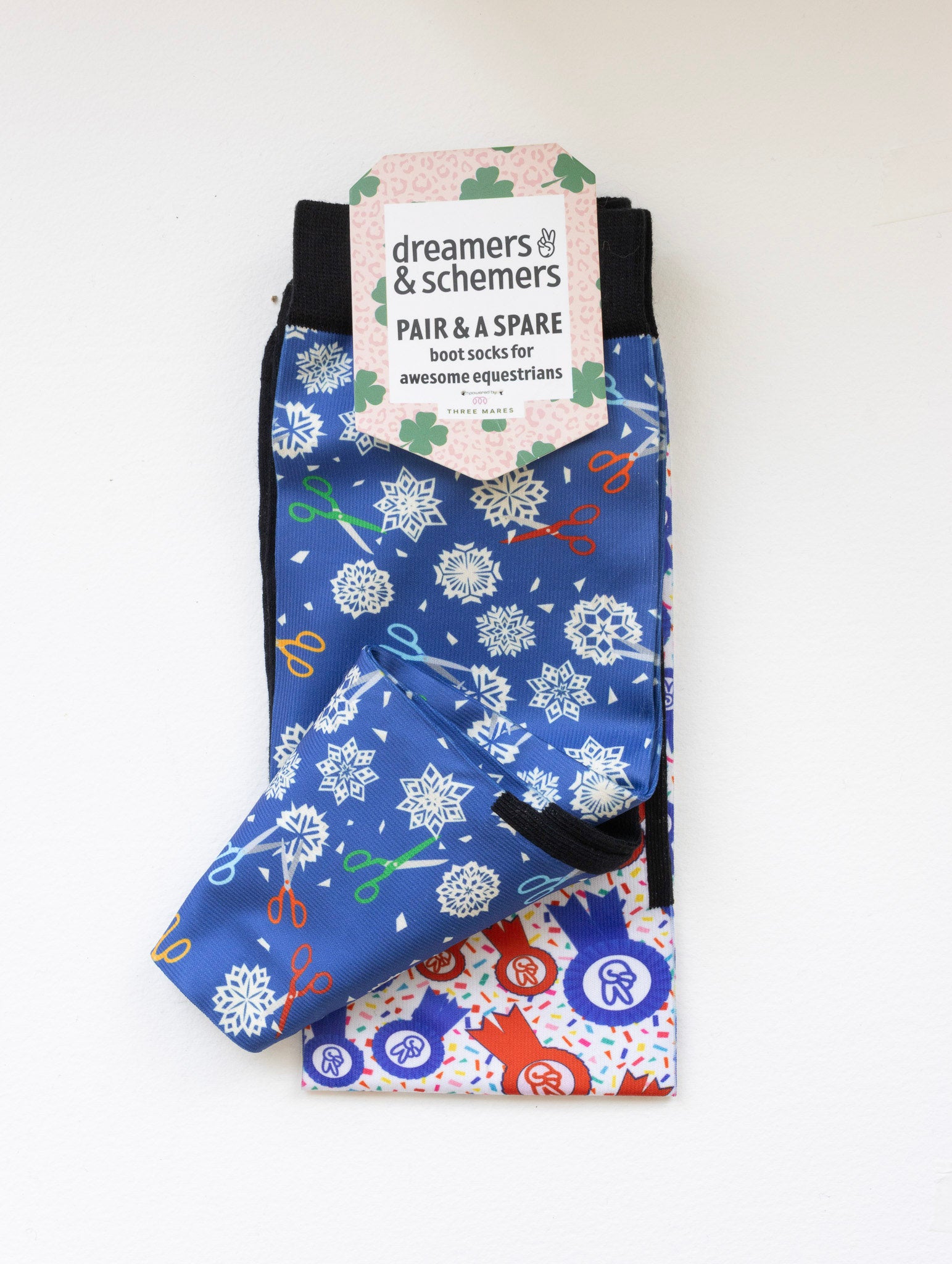 Shear Magic boot socks shown folded with the included spare sock and printed cuff detail