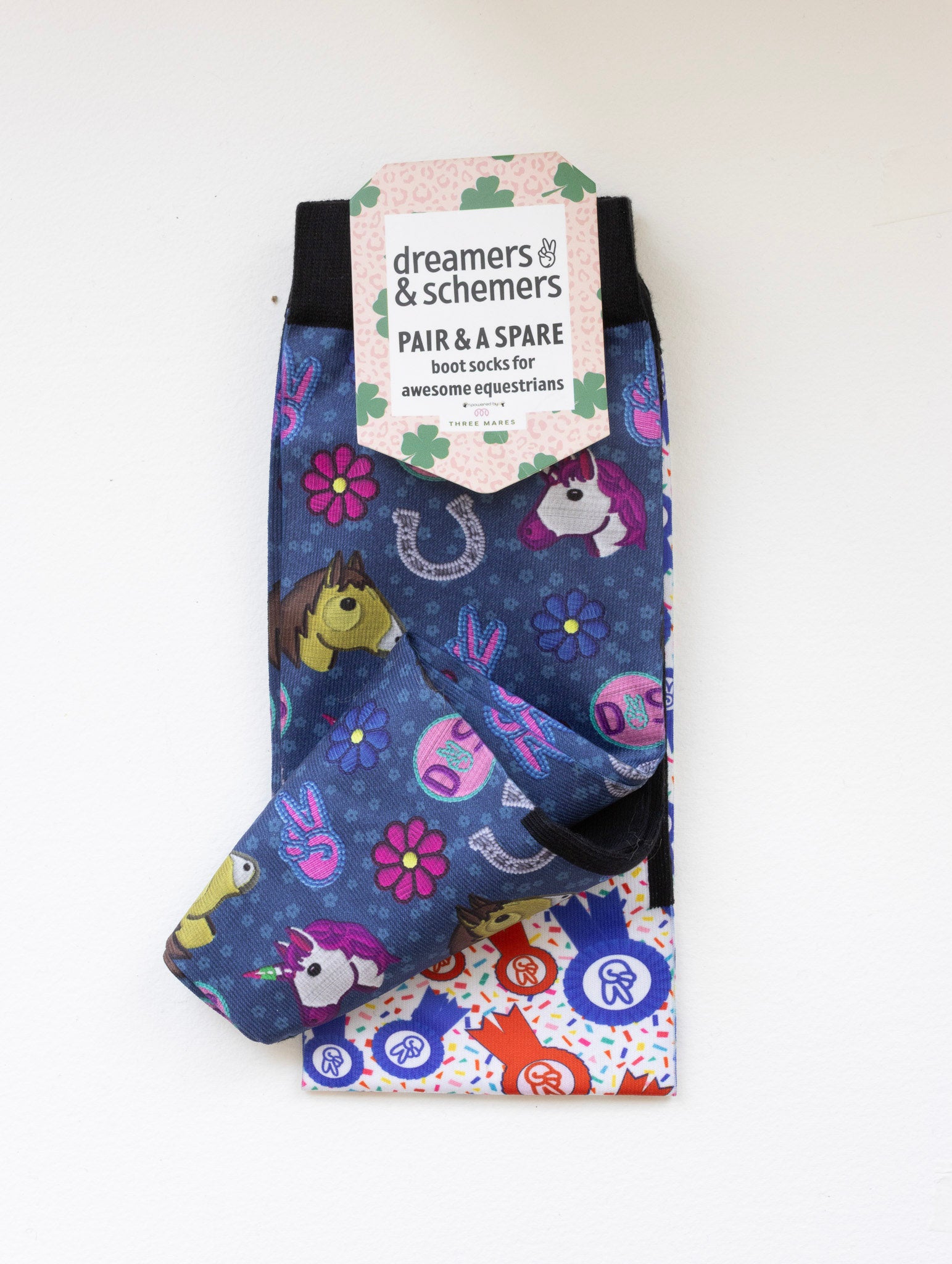 Patch Perfect boot socks shown folded with the included spare sock and printed cuff detail