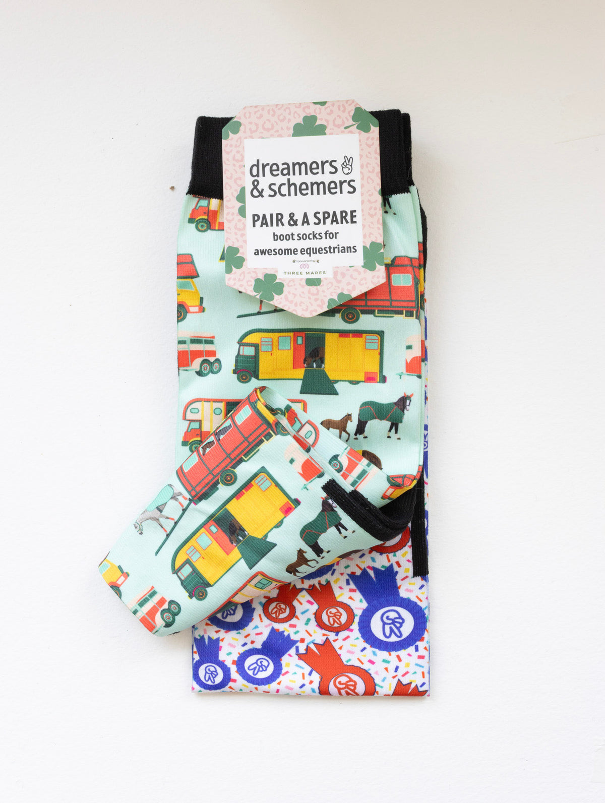 The Pony Island Retro Trailers boot socks shown folded with the included spare sock and printed cuff detail
