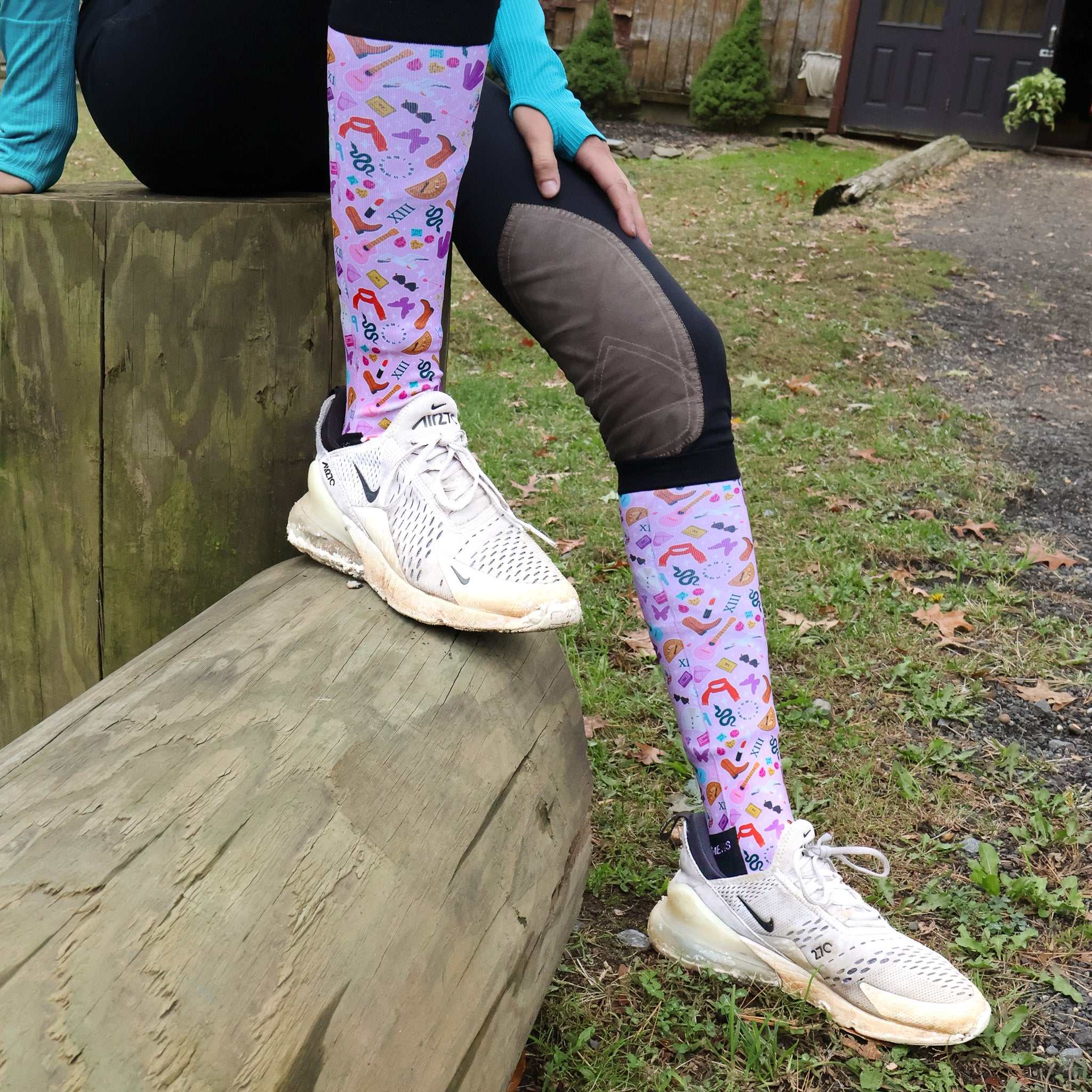Colorful limited edition boot socks with music and shoe patterns worn outdoors
