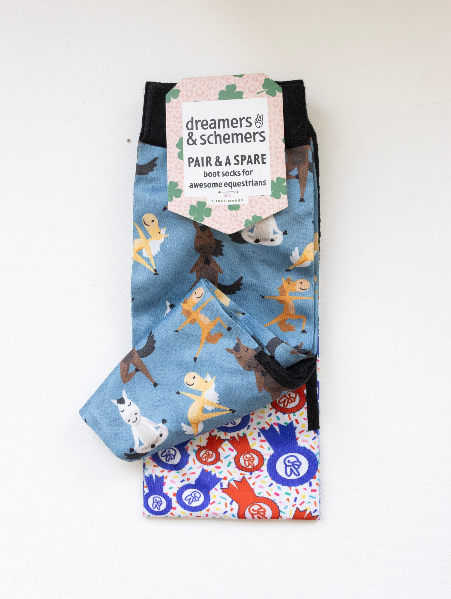 Pony Pilates boot socks shown folded with the included spare sock and printed cuff detail