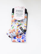 Bookworm youth boot socks shown folded with the included spare sock and patterned cuff