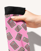 Boobies Limited Edition boot socks, calculator print on pink, held in hand, close-up of the print, by Dreamers & Schemers
