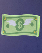 Cash Money expanding horse bath sponge on a navy background, printed side facing up