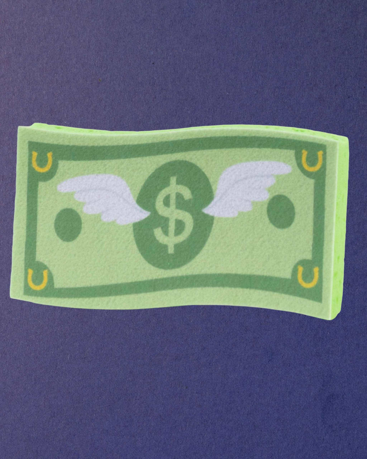 Cash Money expanding horse bath sponge on a navy background, printed side facing up