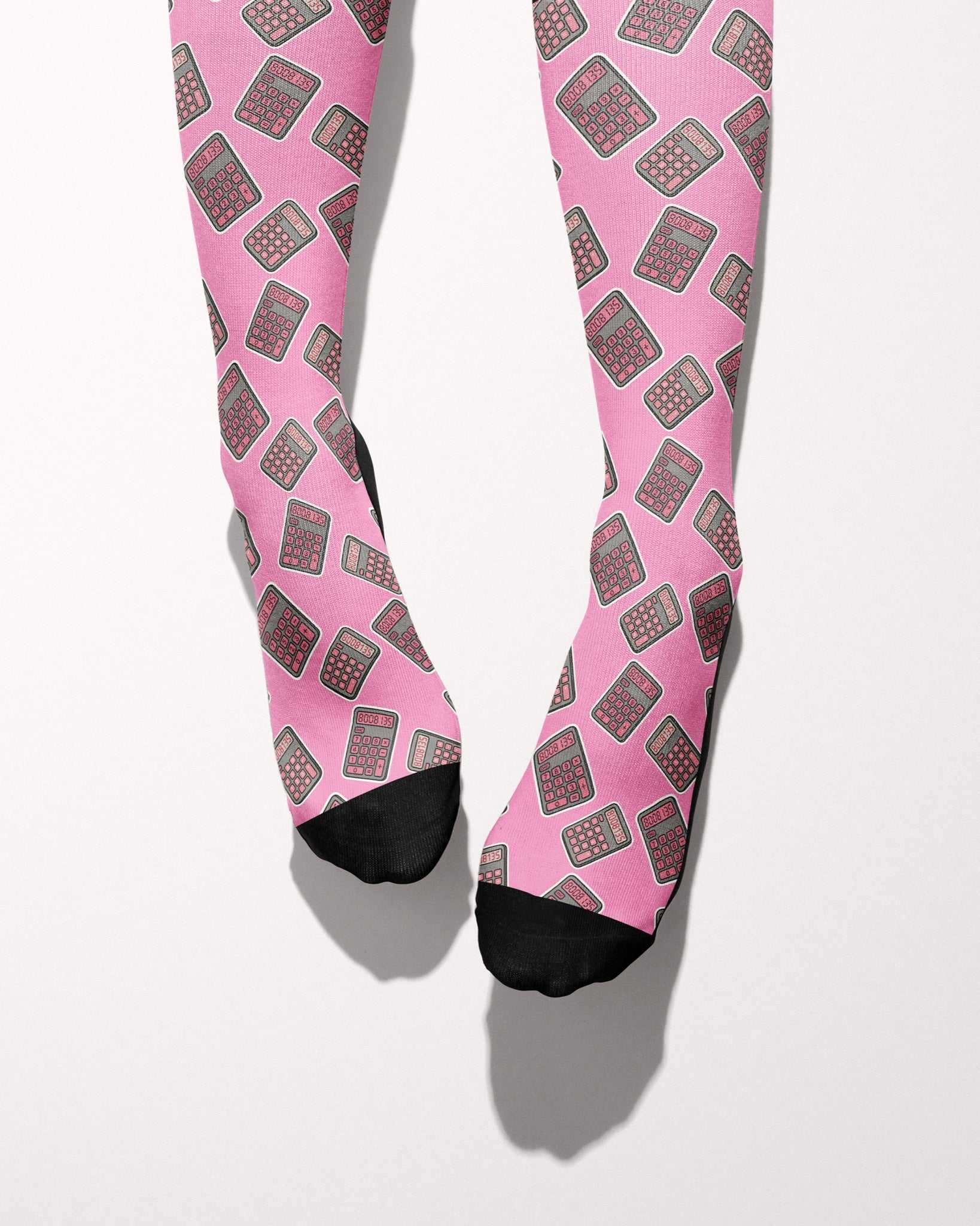 Boobies Limited Edition boot socks, calculator print on pink, worn, showing the full-length pattern, by Dreamers & Schemers