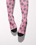 Boobies Limited Edition boot socks, calculator print on pink, worn, showing the full-length pattern, by Dreamers & Schemers