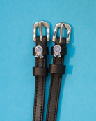 Black leather ManeJane spur straps with silver buckles and blue prize-ribbon rosette charms