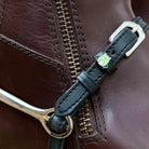 ManeJane frog spur strap fastened on a brown zip-up riding boot with a silver spur