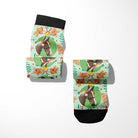 Custom socks with gingerbread cookie and horse design on light green background