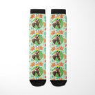 Custom socks with gingerbread cookie and horse design on a light green background