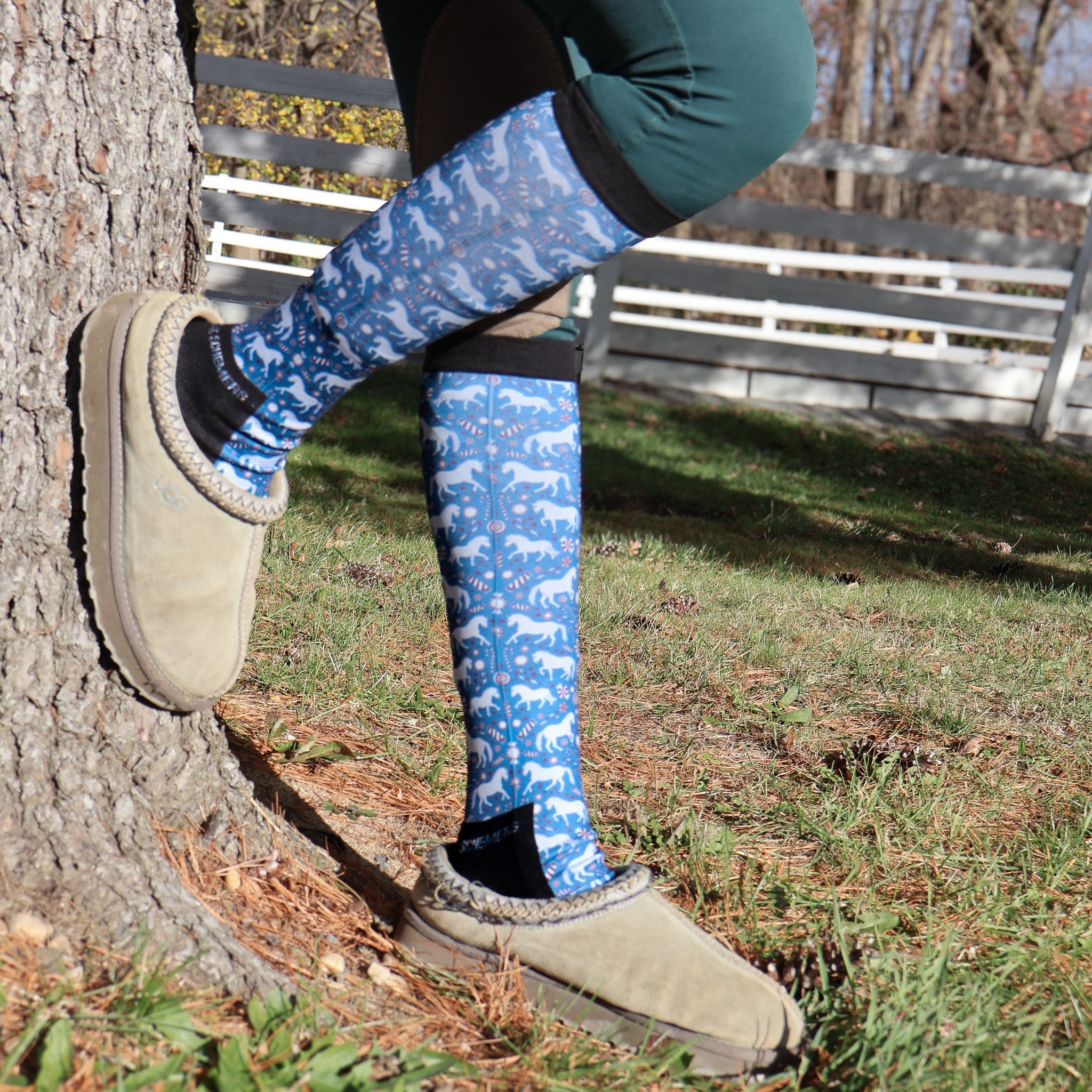 Limited Edition Pony Island Peppermint Ponies Socks blue patterned boot socks with ponies worn outdoors with slippers
