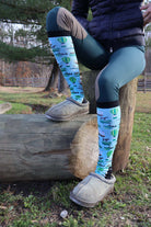 Limited Edition Pony Island Pony Transport Socks with colorful pony and hot air balloon design worn outdoors