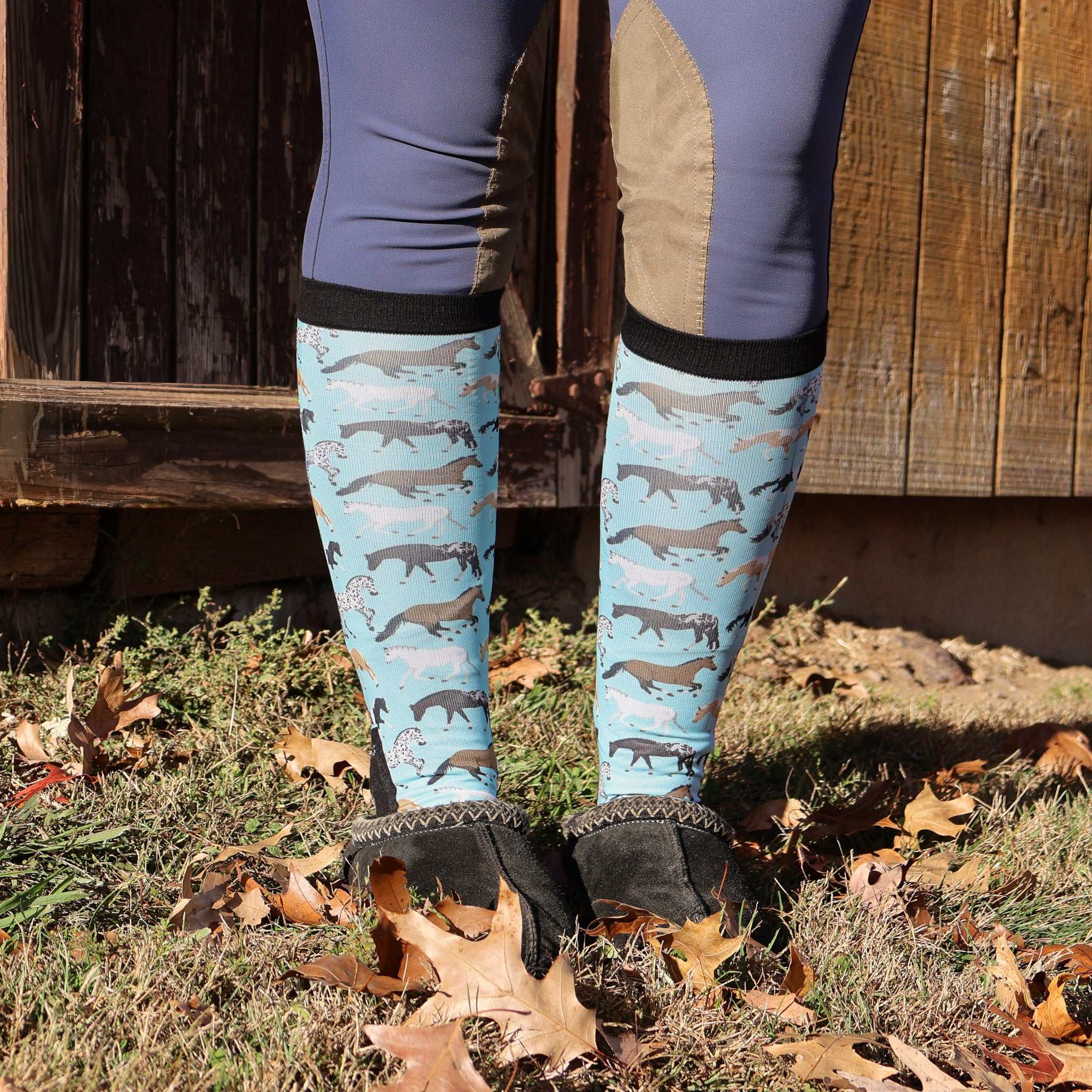 Limited Edition Pony Island Aqua Ponies teal boot socks with playful horse design worn outdoors