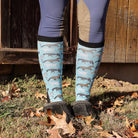 Limited Edition Pony Island Aqua Ponies teal boot socks with playful horse design worn outdoors