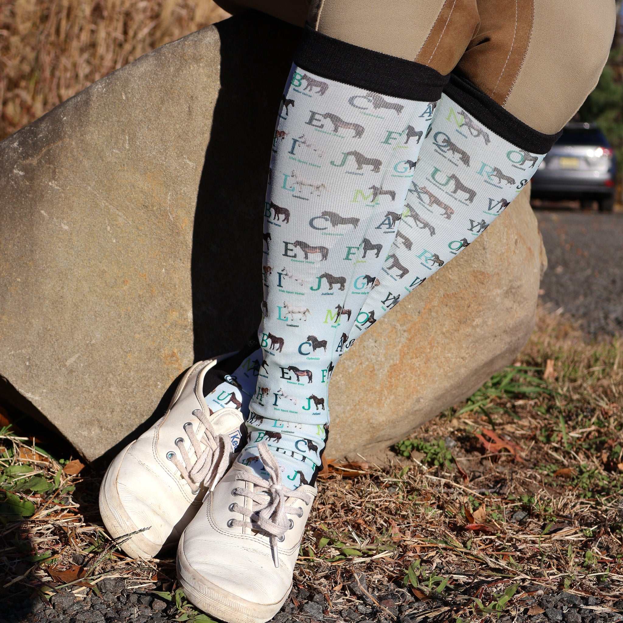 Limited Edition Pony Island Alphabet Horses socks featuring colorful pony and alphabet design worn outdoors