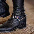 ManeJane Irish flag spur strap fastened on a rider's black riding boot with spur