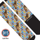 Custom boot socks with cat and trophy pattern on light blue background by Dreamers & Schemers