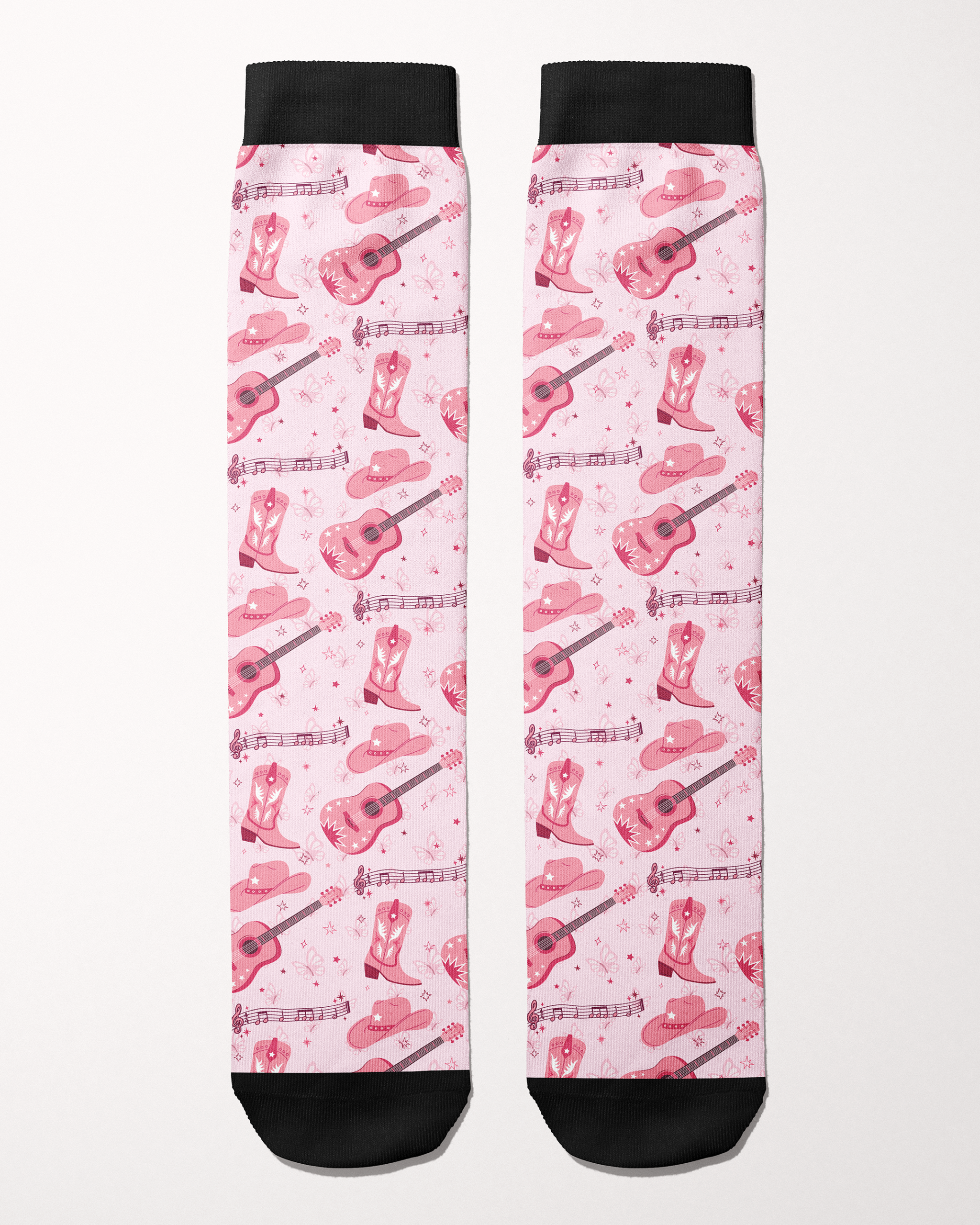 Dolly Forever socks in light pink, full pattern of cowgirl boots, guitars, hats and music notes