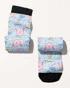 Reading 9-5 boot socks rolled into a pair, pastel blue with open books and butterflies