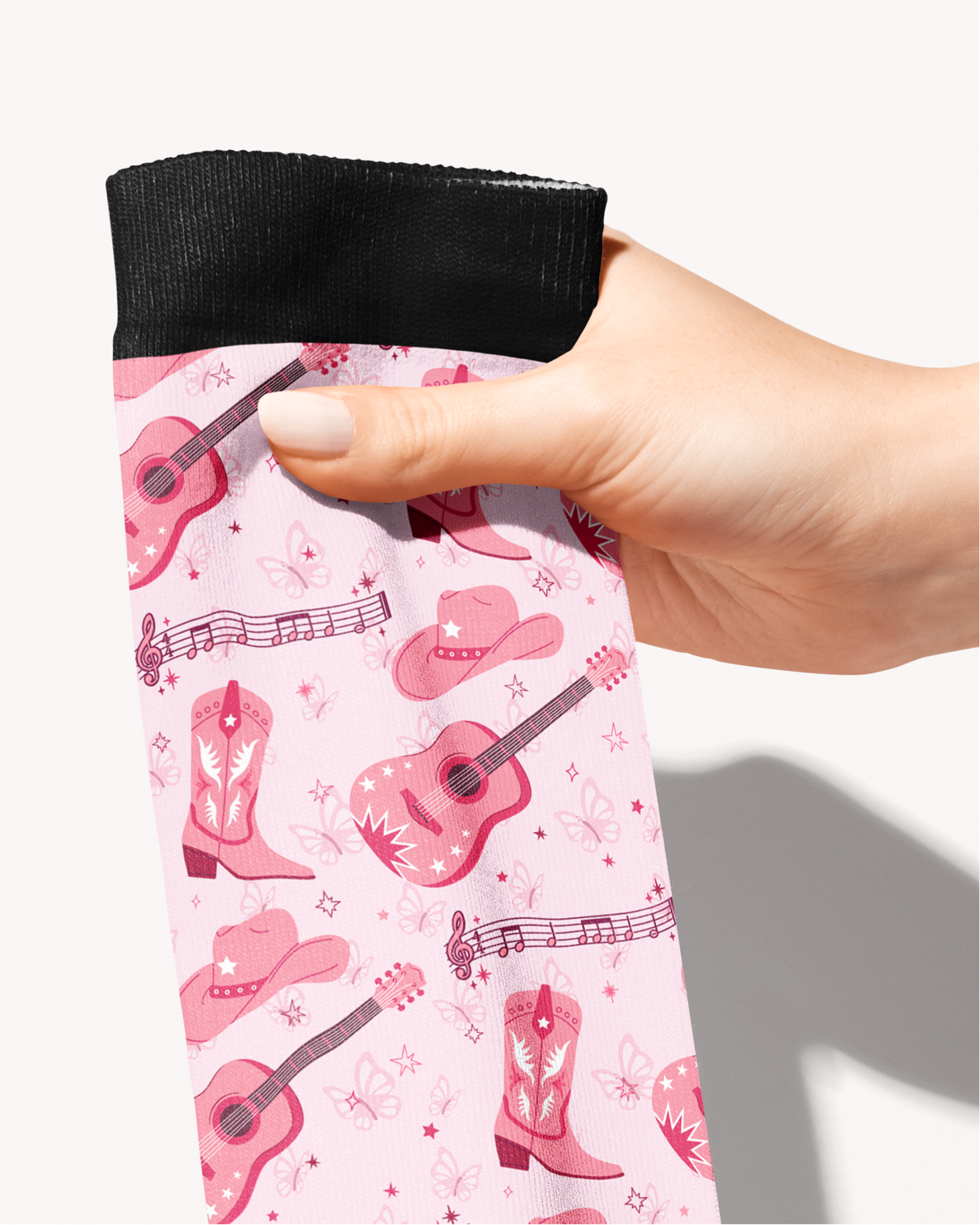 Close-up of the Dolly Forever print — pink guitars, cowgirl boots and hats, by Dreamers & Schemers