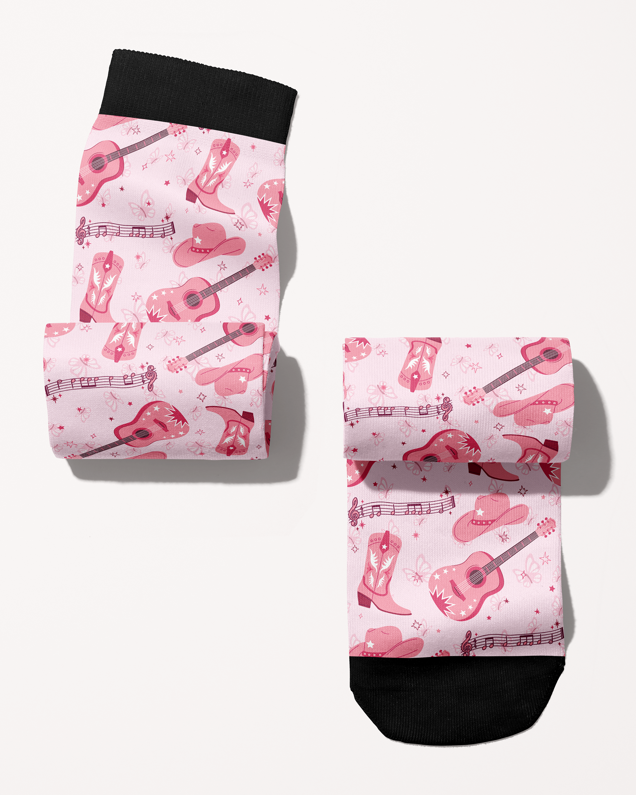 Dolly Forever boot socks rolled into a pair, pink cowgirl boots, guitars and hats print