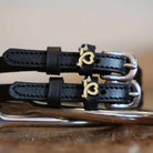 Close-up of gold dachshund heart charms on black leather Long Dogs spur straps, ManeJane