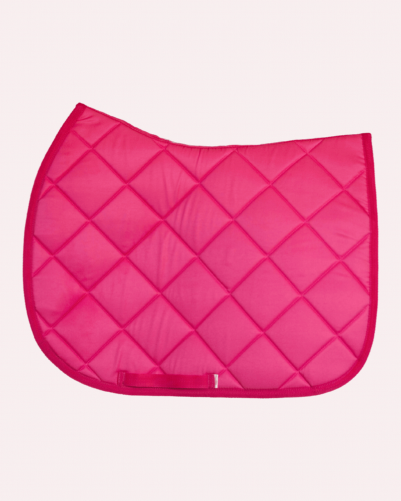 Pink saddle pad, solid hot pink quilted English all-purpose pad shown flat by Dreamers & Schemers