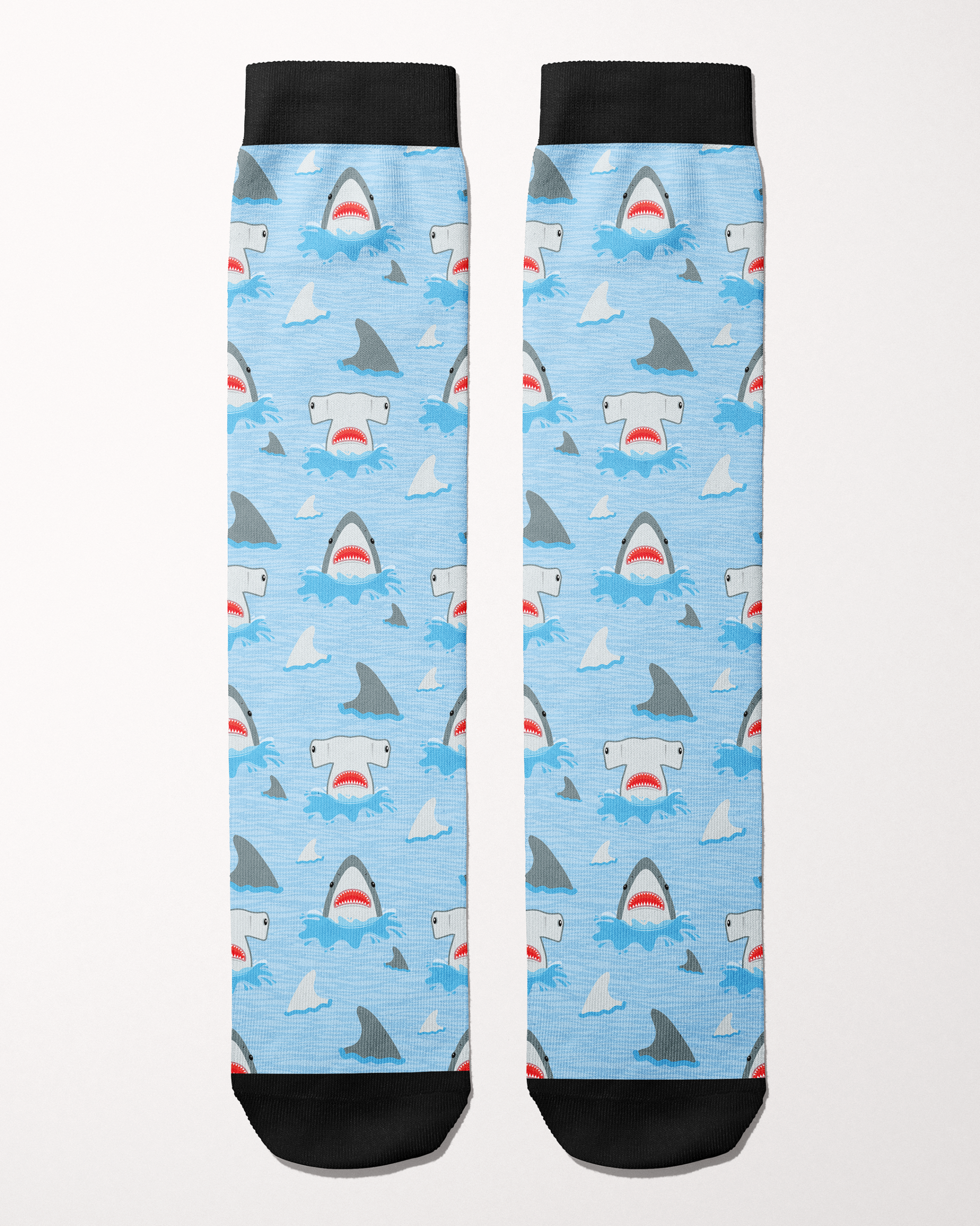 Shark Week Limited Edition equestrian boot socks in blue, flat lay showing the shark-and-fin pattern, by Dreamers & Schemers