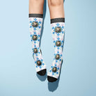custom socks with blue snowflake pattern and personalized images on white background
