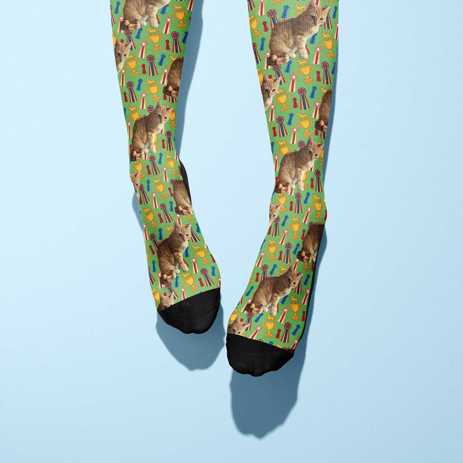 Custom boot socks with cat and trophy pattern on green background